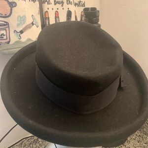 Women’s 100% wool wide brim black hat. Normal wear. Size 7 ribbon bow/ribbon